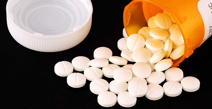 Image of pills spilled from prescription bottle