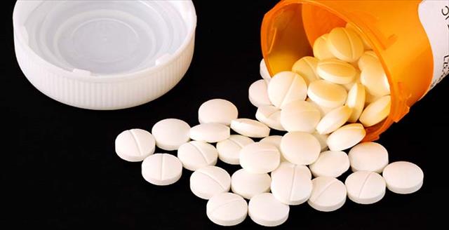 Image of pills spilled from prescription bottle