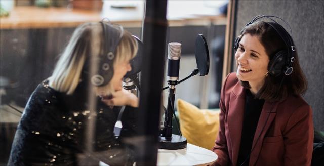 two women recording a podcast