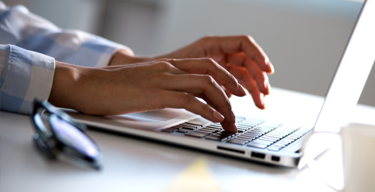 Image of hands working on keyboard