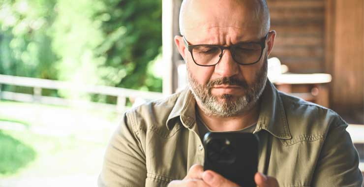 man watching video on his phone