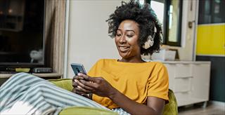 Woman using her cellphone for a video call
