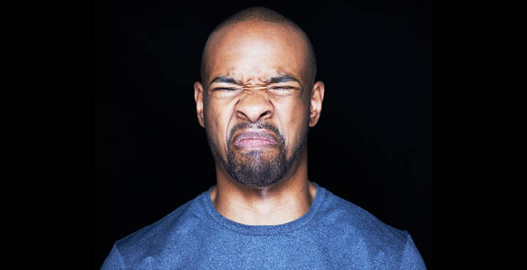 Man making a face indicating disgust