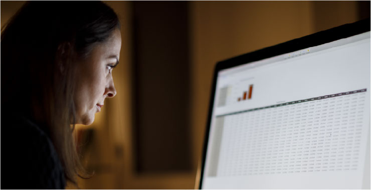 Businesswoman looking at computer screen