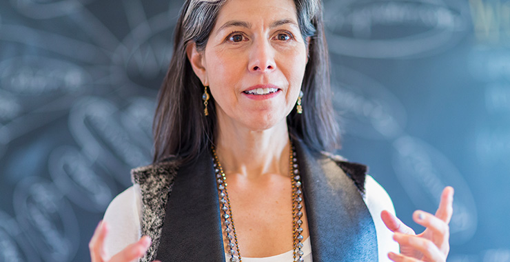 Teacher standing in front of a blackboard