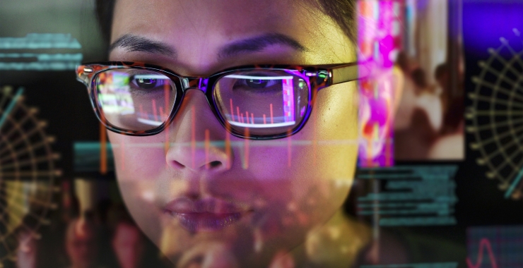 Reflection of computer screen on a woman
