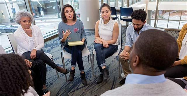 A group of people in a difficult moment during a breakout session