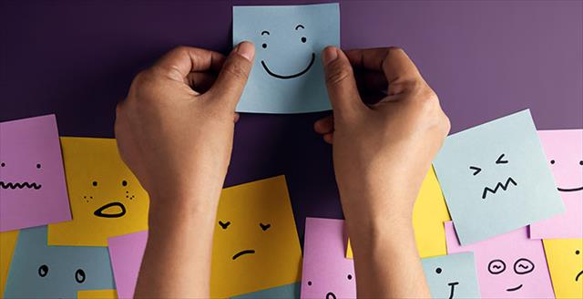 Mind, mental health concept. Varieties of mood and emotion inside out. Many sticky notes on board with handwriting cartoon emoticon face.