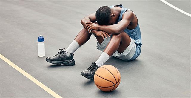 Basketball man, sports burnout and game fatigue on court sport training