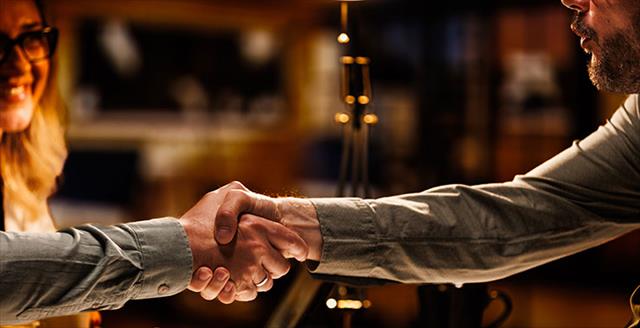 Business people shaking hands after a successful meeting
