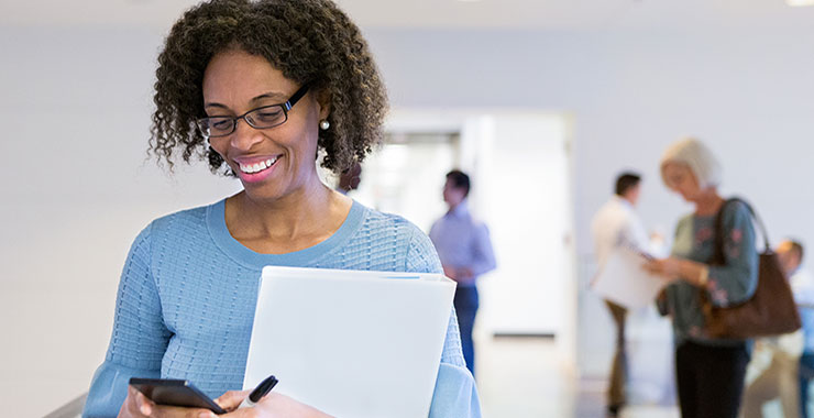 Older African American woman using smart phone.