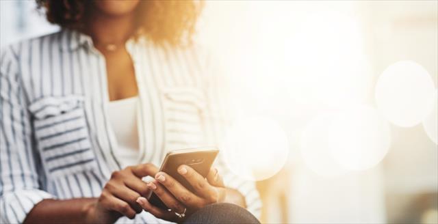 Shot of woman's hands holding a smartphone