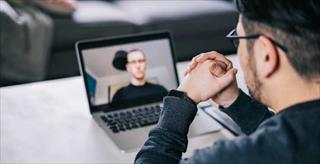 Man taking part of a video call from home 