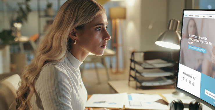 Young woman looking at computer screen