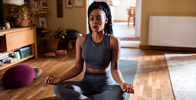 Lady doing yoga at home