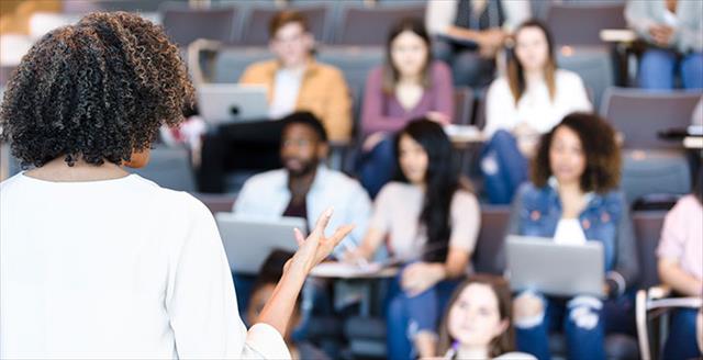 Students paying attention to teacher in lecture hall