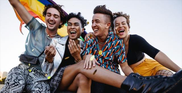 Friends celebrating with pride flag