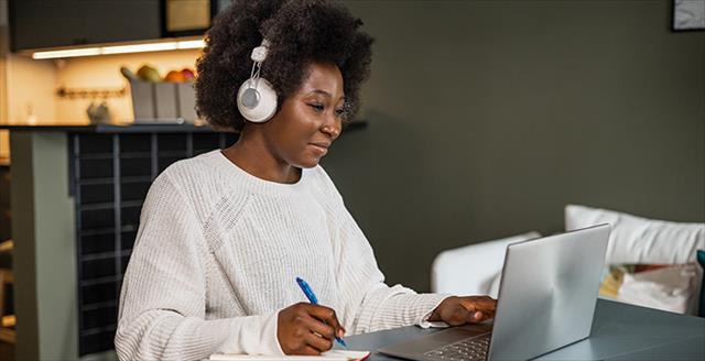 person at computer participating in an online webinar
