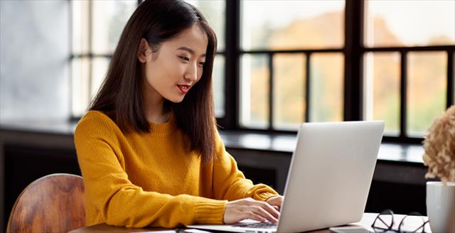 apa bibliography online journal Woman typing on a laptop in a peaceful office