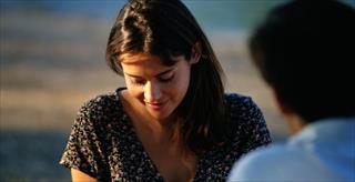 Shy woman looking down.