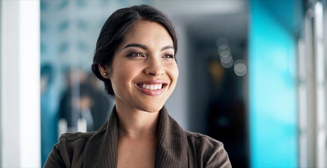 Image of a designer smiling in an office