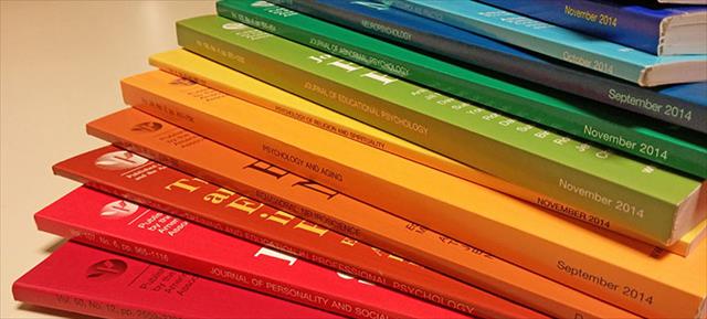 photo of stack of APA journals in bright colors