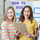 Middle school girls deliver science fair presentation.