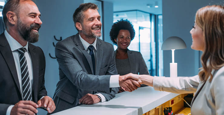 One person shaking another person a handshake