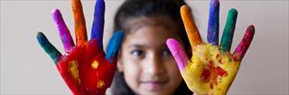 Girl with colorful hands