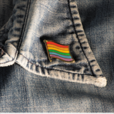 LGBTQ pin on a jean jacket