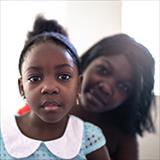 woman of color with her young daughter